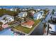 Aerial view of a waterfront home featuring lush lawn and direct access to canal, close to wide bay at 780 Jungle Queen Way, Longboat Key, FL 34228