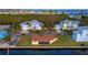 Overhead view of house featuring a spacious yard, waterfront access, and tropical landscaping at 780 Jungle Queen Way, Longboat Key, FL 34228