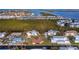 Beautiful waterfront home offering stunning views of the bay, with lush landscaping and ample boating opportunities at 780 Jungle Queen Way, Longboat Key, FL 34228