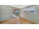 Bright bedroom with sliding glass doors to a screened lanai with serene canal views at 780 Jungle Queen Way, Longboat Key, FL 34228