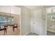 Hallway view of dining area with waterfront view, offering relaxed dining by the water at 780 Jungle Queen Way, Longboat Key, FL 34228