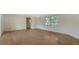 Open concept living room with hardwood floors and bright, natural light at 780 Jungle Queen Way, Longboat Key, FL 34228