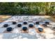 An outdoor checkerboard in a landscaped backyard at 7804 Edmonston Cir, University Park, FL 34201