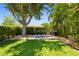 Landscaped backyard with a checker board game at 7804 Edmonston Cir, University Park, FL 34201