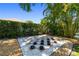 A tiled checkerboard in a landscaped backyard at 7804 Edmonston Cir, University Park, FL 34201