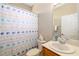 Bathroom with a vanity, toilet, and shower with a decorative curtain at 7804 Edmonston Cir, University Park, FL 34201