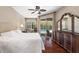 Bedroom featuring a view of the pool and a dark wood dresser at 7804 Edmonston Cir, University Park, FL 34201