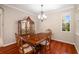 Formal dining room features a wood table with matching chairs and a china cabinet at 7804 Edmonston Cir, University Park, FL 34201