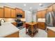 Well-equipped kitchen featuring stainless steel appliances, ample counter space, and custom cabinetry at 7804 Edmonston Cir, University Park, FL 34201