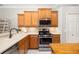 This kitchen features stainless steel appliances, countertops, and wooden cabinetry at 7804 Edmonston Cir, University Park, FL 34201