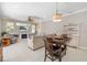 Open living space with fireplace, comfortable seating, and an adjacent dining area at 7804 Edmonston Cir, University Park, FL 34201