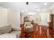 Spacious living area with wood floors, neutral walls, and ample seating at 7804 Edmonston Cir, University Park, FL 34201