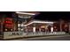 Night view of the mall entrance featuring modern architecture, landscape lighting, and prominent signage at 7804 Edmonston Cir, University Park, FL 34201