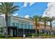 Exterior shot of several restaurants, including The Capital Grille and Brio, lined with palm trees at 7804 Edmonston Cir, University Park, FL 34201