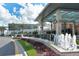 View of the mall entrance with a water feature and lush landscaping on a sunny day at 7804 Edmonston Cir, University Park, FL 34201