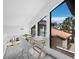 Bright hallway with desk overlooking the exterior, letting in an abundance of natural light at 800 S Blvd Of The Presidents # 19, Sarasota, FL 34236