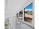 Bright hallway with desk overlooking the exterior, letting in an abundance of natural light at 800 S Blvd Of The Presidents # 19, Sarasota, FL 34236