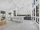 Bright, open-concept living room with modern furnishings, island seating, and light, neutral decor at 800 S Blvd Of The Presidents # 19, Sarasota, FL 34236