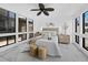 Serene main bedroom with modern furnishings, neutral color palette, and natural light at 800 S Blvd Of The Presidents # 19, Sarasota, FL 34236