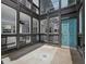 Large patio with multiple windows allowing an abundance of natural light inside at 800 S Blvd Of The Presidents # 19, Sarasota, FL 34236