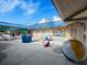 Outdoor recreation area featuring painted walls, beach balls, covered picnic tables and an attractive blue metal roof at 800 S Blvd Of The Presidents # 19, Sarasota, FL 34236