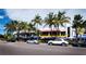 Charming street view showing dining options with umbrellas and palm trees creating a pleasant atmosphere at 800 S Blvd Of The Presidents # 19, Sarasota, FL 34236
