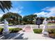 Statues frame the entrance to a park, complemented by clear skies and lush greenery, enhancing the beauty at 800 S Blvd Of The Presidents # 19, Sarasota, FL 34236
