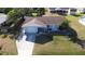 Aerial shot showcasing the home's layout, driveway, lawn, and surroundings at 807 Mohawk Rd, Venice, FL 34293