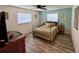 Cozy bedroom with ample natural light, neutral decor, and new flooring at 807 Mohawk Rd, Venice, FL 34293