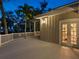 Spacious outdoor deck with a white railing, perfect for entertaining or enjoying the evening ambiance at 8871 Fishermens Bay Dr, Sarasota, FL 34231