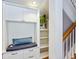 Entryway featuring built-in cabinets, a seating area, and shelving at 8871 Fishermens Bay Dr, Sarasota, FL 34231