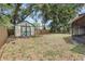 Backyard features a wooden shed and a partial fence at 920 36Th W St, Bradenton, FL 34205