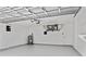 Spacious garage with painted floors, white walls, and overhead storage at 920 36Th W St, Bradenton, FL 34205