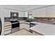 Well-maintained kitchen featuring white cabinets, stainless steel appliances, and ample counter space at 920 36Th W St, Bradenton, FL 34205