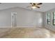 Vaulted ceiling living room with neutral paint, tile floors, and bright windows at 920 36Th W St, Bradenton, FL 34205