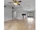 Open-concept living room with tile floors, neutral paint, and vaulted ceilings at 920 36Th W St, Bradenton, FL 34205