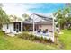 Rear exterior view showcasing pool with screened-in patio area at 104 Shoreland Dr, Osprey, FL 34229