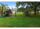 Large backyard with play set at 104 Shoreland Dr, Osprey, FL 34229