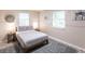 A bright bedroom features modern decor, soft rug, and natural light at 104 Shoreland Dr, Osprey, FL 34229