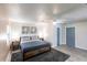 Cozy bedroom with a modern aesthetic featuring a comfortable bed and lots of light at 104 Shoreland Dr, Osprey, FL 34229