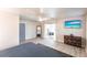 A spacious main bedroom with a ceiling fan, dresser, balcony, and hardwood floors at 104 Shoreland Dr, Osprey, FL 34229