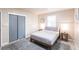 Cozy bedroom featuring a comfortable bed, soft rug, and closet at 104 Shoreland Dr, Osprey, FL 34229