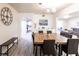 Bright dining room with a large wooden table, comfortable seating, and elegant decor at 104 Shoreland Dr, Osprey, FL 34229