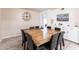 Dining area featuring a solid wood table with seating for eight and built-in white storage cabinets at 104 Shoreland Dr, Osprey, FL 34229