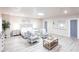 Expansive main bedroom featuring a king bed, sitting area, and elegant décor, perfect for relaxing at 104 Shoreland Dr, Osprey, FL 34229