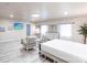 Bright and airy main bedroom with large windows, a stylish sitting area, and ample natural light at 104 Shoreland Dr, Osprey, FL 34229