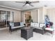 Cozy covered patio area with fire pit at 104 Shoreland Dr, Osprey, FL 34229