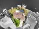 Black and white aerial view showcasing a waterfront home with a private dock and lush landscaping at 10432 Sandpiper W Rd, Bradenton, FL 34209