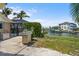 Backyard with an outdoor grill, perfect for entertaining near the water on the dock at 10432 Sandpiper W Rd, Bradenton, FL 34209