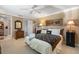 Comfortable bedroom with neutral walls, carpet, ceiling fan, and ample natural light at 10432 Sandpiper W Rd, Bradenton, FL 34209